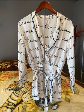 Victoria's Secret white satin romper with black writing. Size M